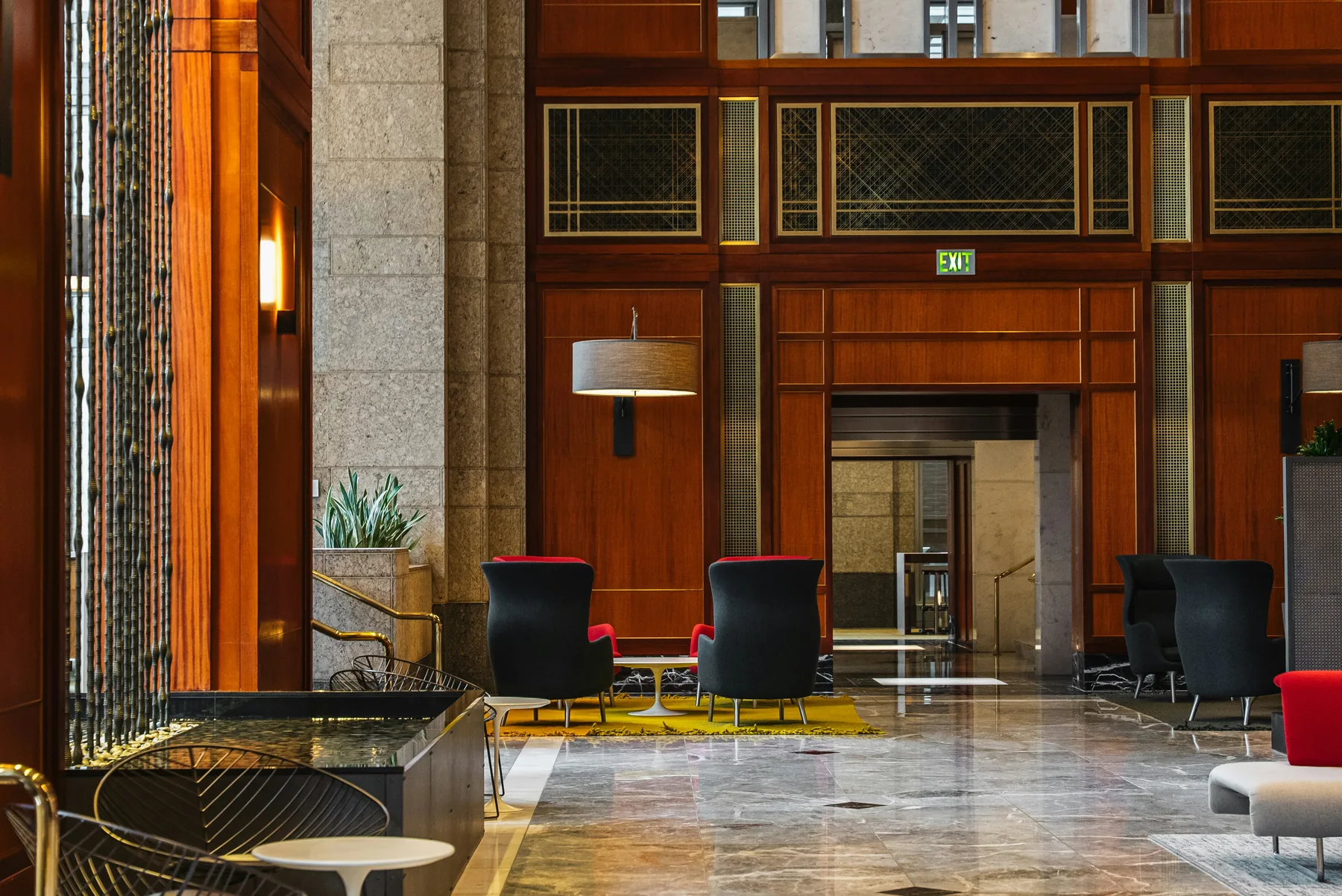 Elegant hospitality lobby with wood paneling and lounge seating