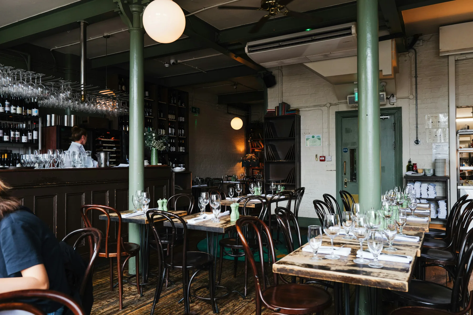 Hospitality restaurant interior with prepared tables and bar area